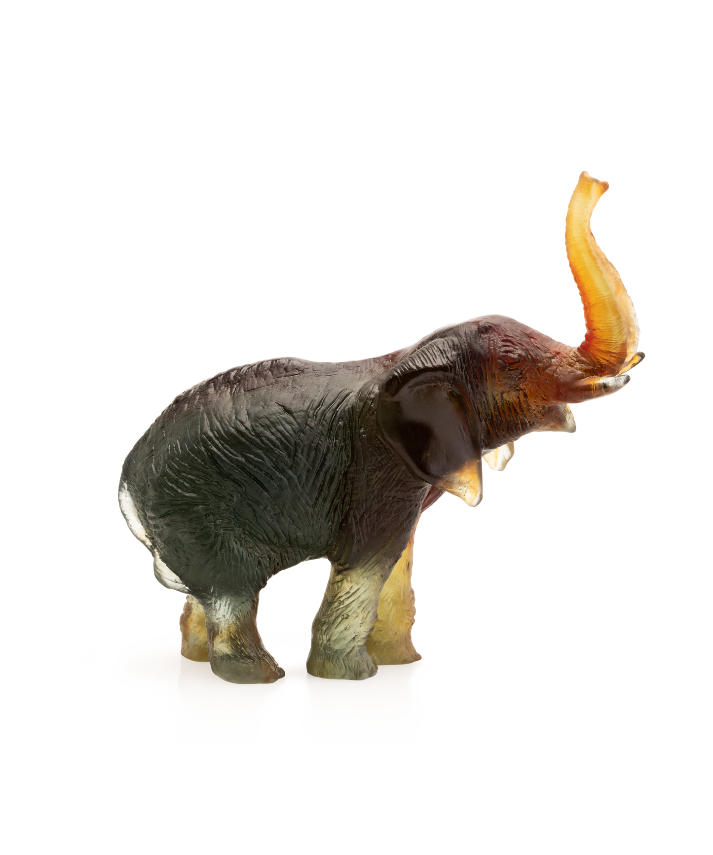 Éléphant moyen en verre vert et ambre de Jean-François Leroy, pièce artisanale de la marque Daum, visible en détail.