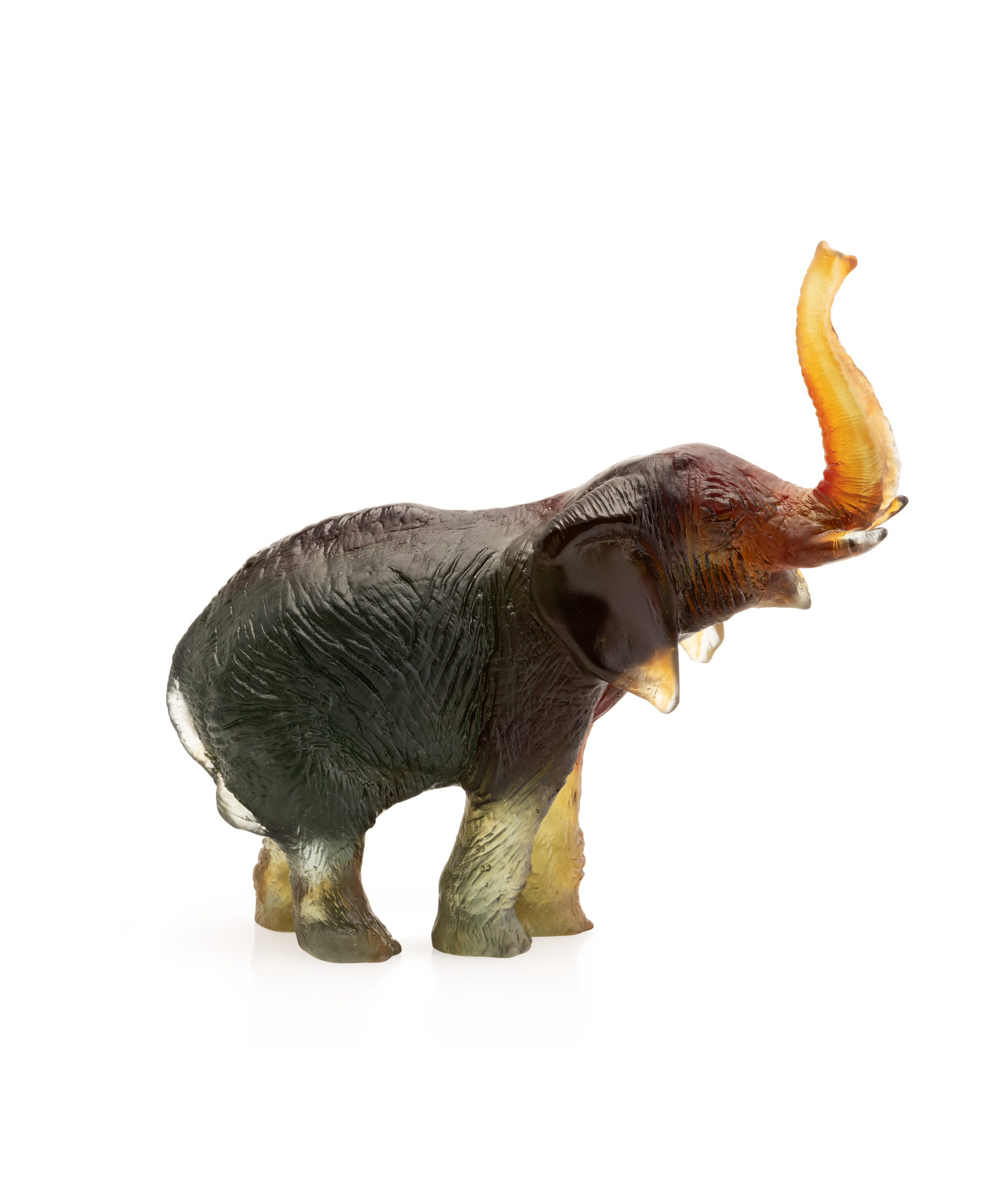 Éléphant moyen en verre vert et ambre de Jean-François Leroy, pièce artisanale de la marque Daum, visible en détail.