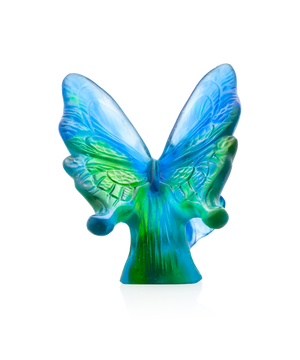 Papillon en verre bleu et vert de la marque Daum, avec détails colorés et finition élégante.