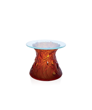 Bout de canapé végétale en verre couleur ambre de la marque Daum, avec un design élégant et artistique.